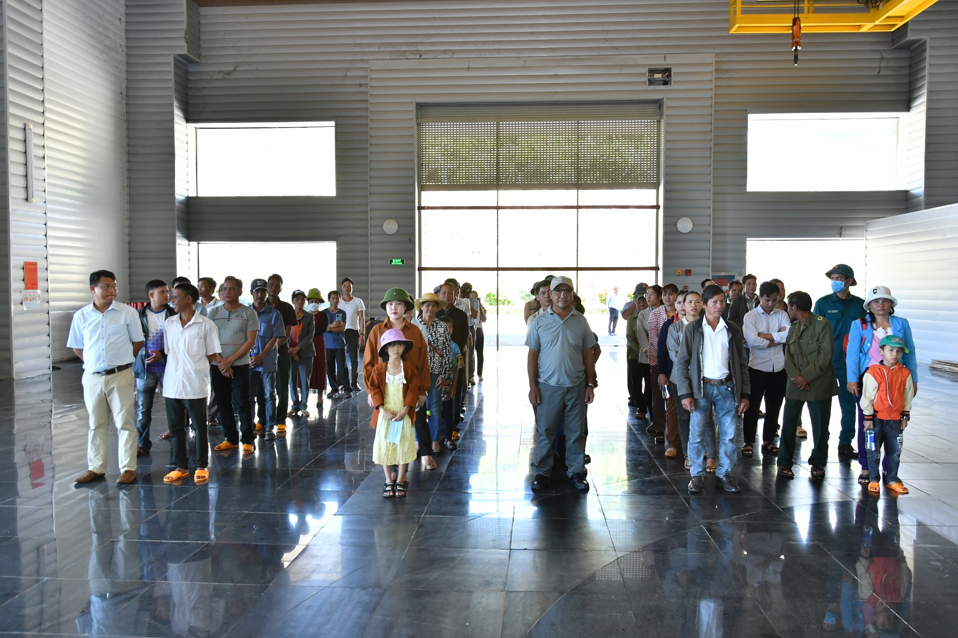 A group of people standing in a lineDescription automatically generated