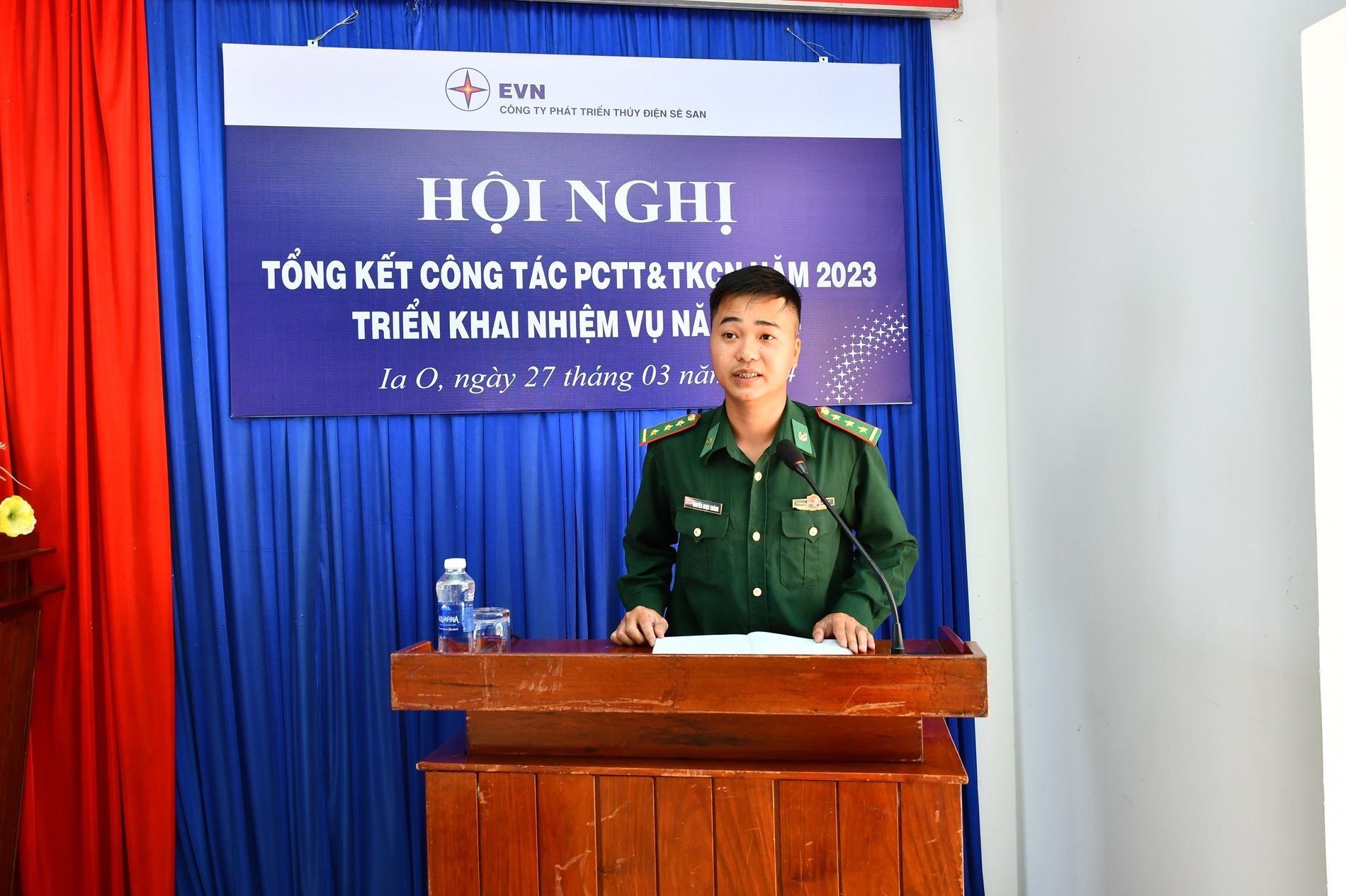 A person in a uniform standing at a podiumDescription automatically generated